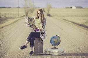 Woman in Road Looking at a Map